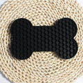 Gray bone-shaped silicone dog slow feeder lick mat with raised honeycomb texture, size 18 x 11 x 1 cm and weight 55 g shown on image