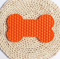 Gray bone-shaped silicone dog slow feeder lick mat with raised honeycomb texture, size 18 x 11 x 1 cm and weight 55 g shown on image